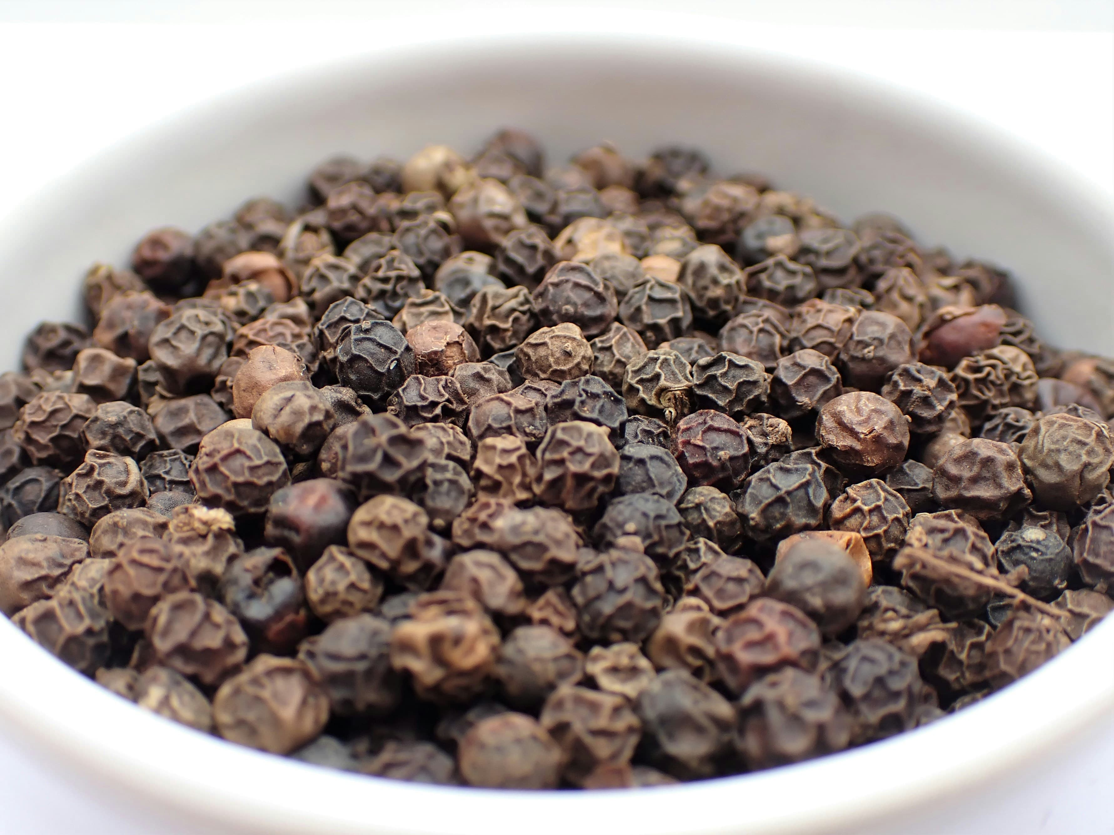 Whole black peppercorns